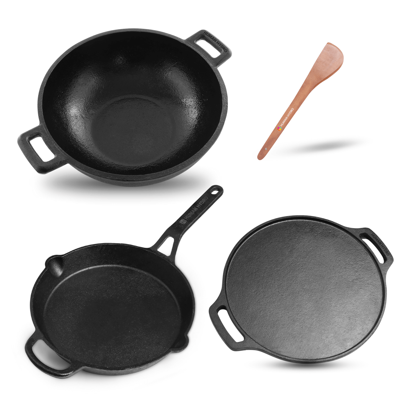 Collection of black cast iron cookware including a skillet, griddle, and wok with a wooden spatula.