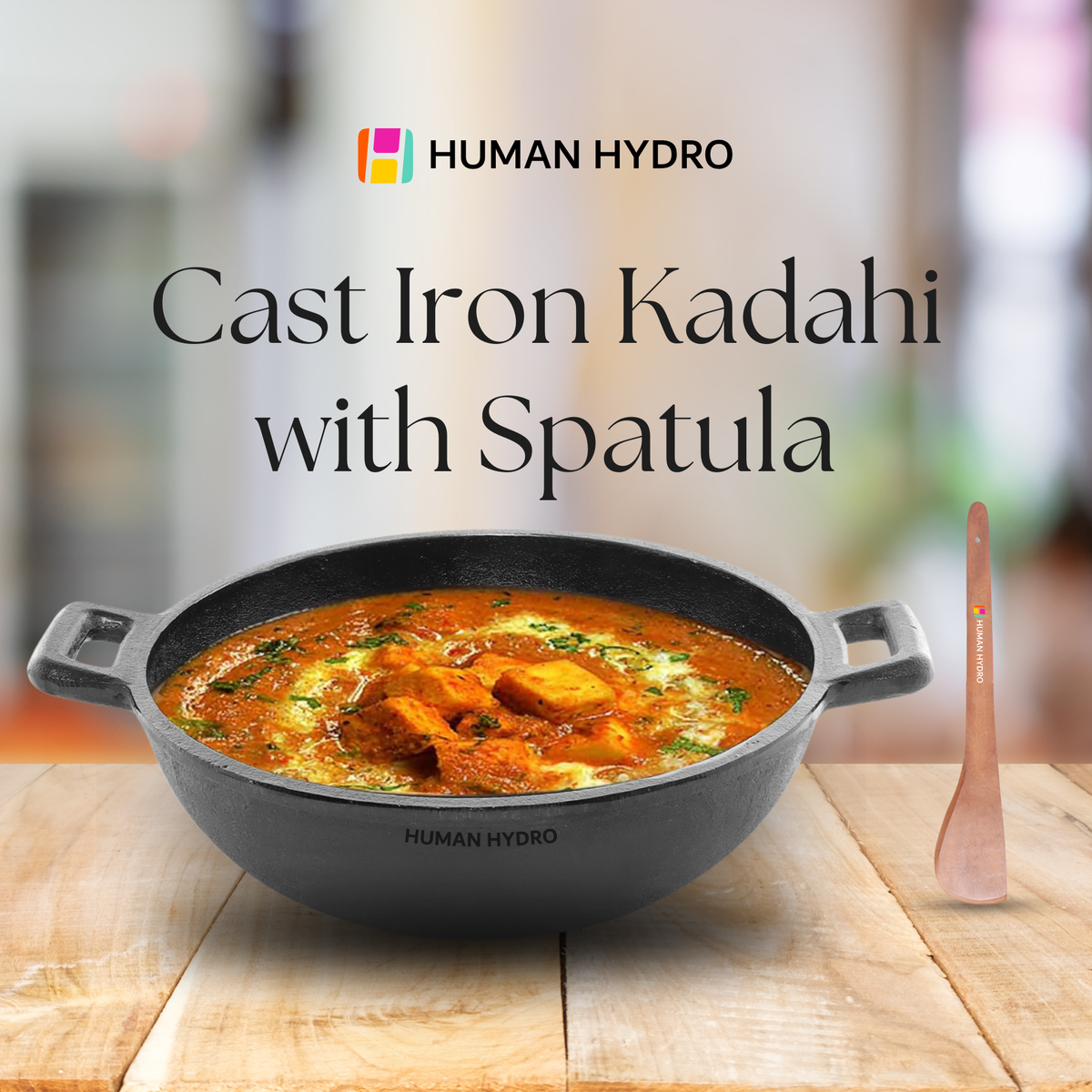 cast iron kadai with spatula text