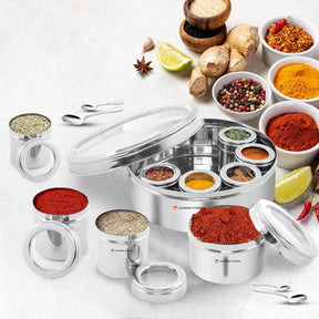 9-in-1 stainless steel masala dabba with spices, see-through lid, and mini containers for kitchen organization.