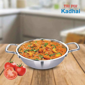 Tri-Ply stainless steel kadai with curry dish and fresh tomatoes, perfect for frying and sautéing in the kitchen.