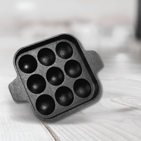 Cast Iron 9-Pit Paniyaram Pan with 9 deep pits, perfect for making paniyarams and traditional Indian snacks.