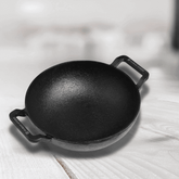 Premium pre-seasoned 3L cast iron kadai with handles, ideal for slow cooking and frying.