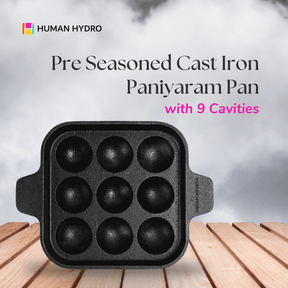 Pre-seasoned cast iron paniyaram pan with 9 cavities, perfect for traditional Indian cooking.