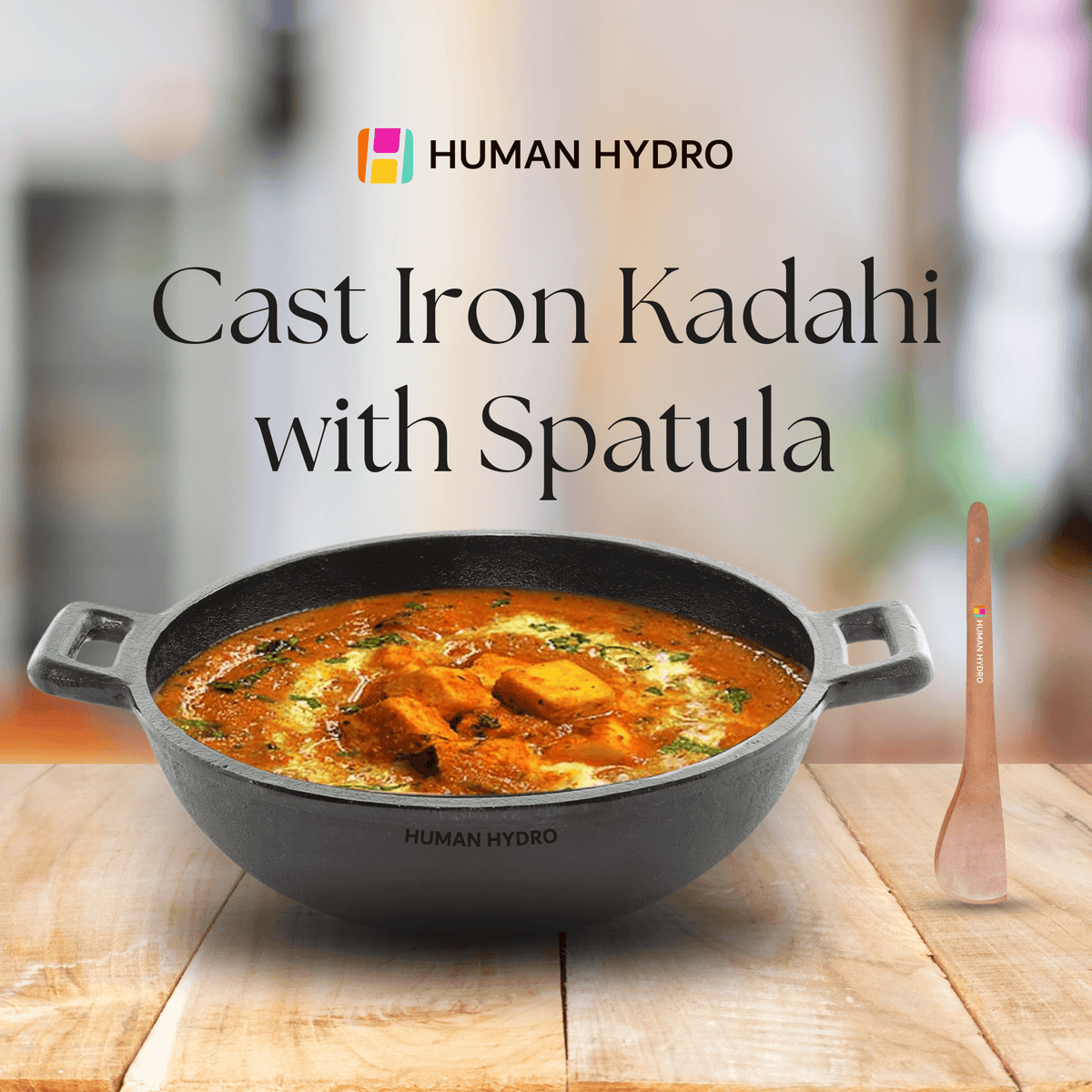 Pre-Seasoned Cast Iron Kadai with Wooden Spatula, ideal for cooking curries and deep frying.