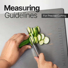 Close-up of hand slicing cucumber on stainless steel chopping board with measuring guidelines for precise cutting.