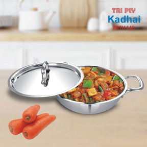 Tri-Ply stainless steel kadai with lid, 22CM, filled with colorful stir-fried vegetables, along with fresh carrots.